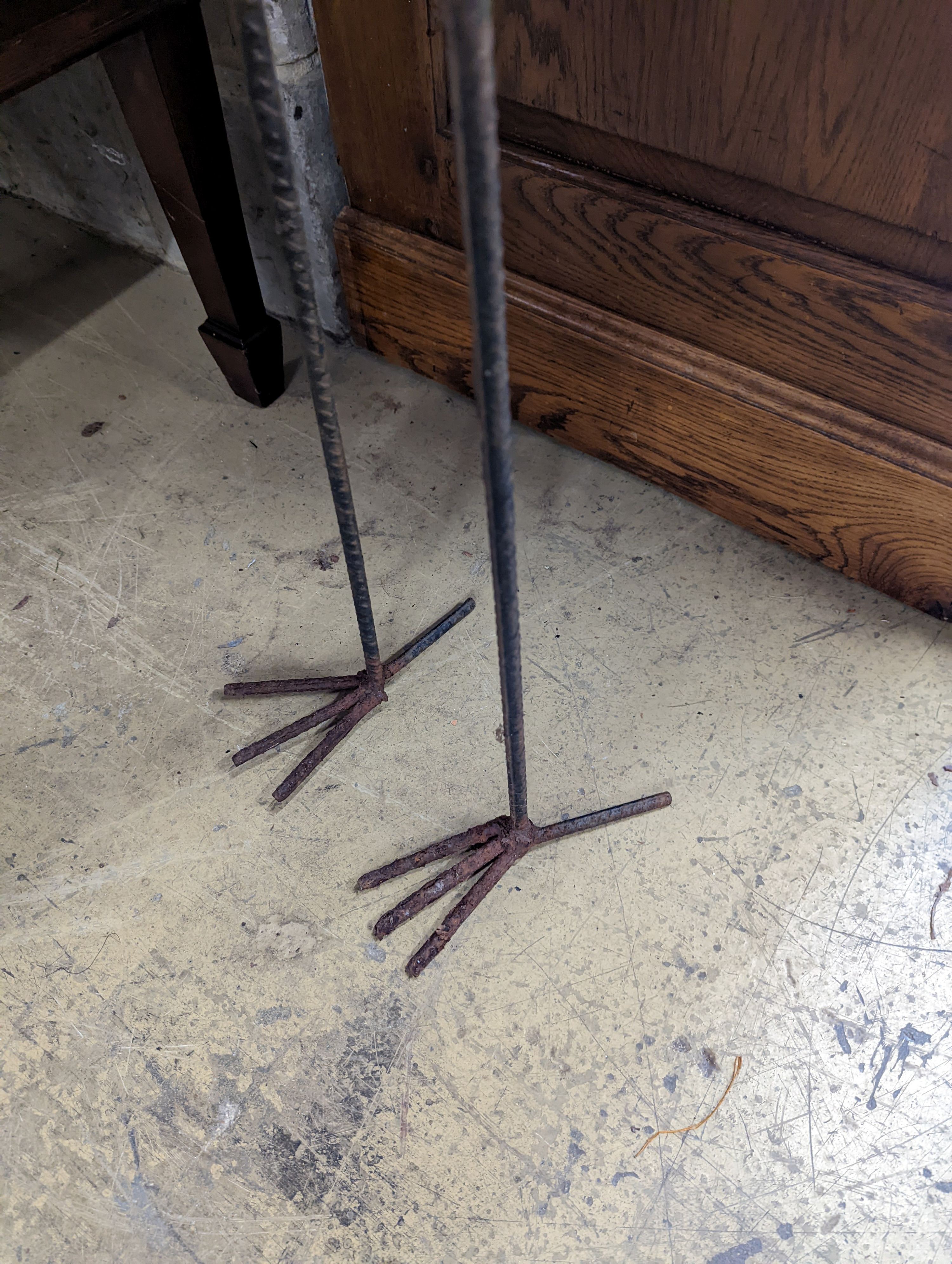 A wrought iron peacock garden ornament, height 170cm